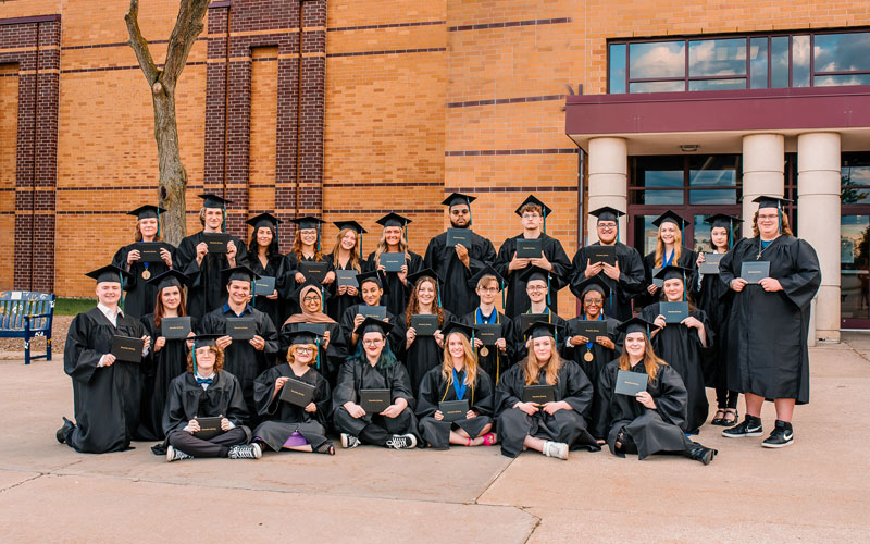 A group of students in their graduation outfits - Wisconsin Connections Academy