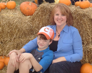 Cathy and her son at a pumpkin patch
