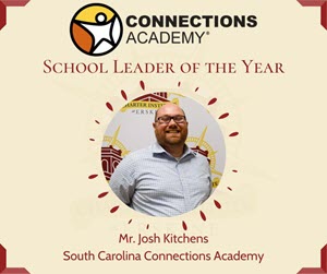 Image of Laura Ferguson holding a Teacher of the Year award