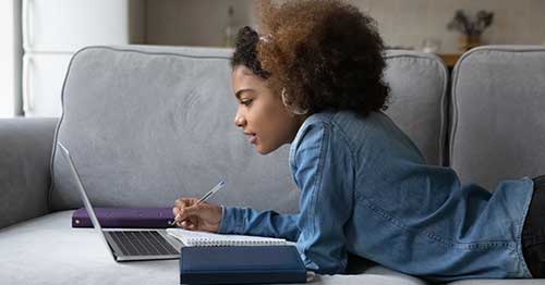 An online student pursuing a tech career.